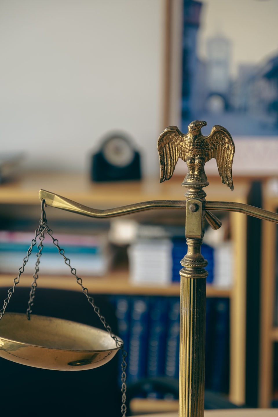 Brass scale of justice with eagle emblem.
